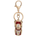 Detailed close-up of a golden racing car keychain with red enamel and sparkling rhinestones - Gold Car