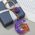Letter G keychain with purple and orange gradient resin, glitter and floral charm - Letter G