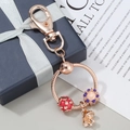 Rose gold DIY keychain with mushroom and flower charms on a premium gift box background - Mushroom Enamel Beaded Style / Rose Gold