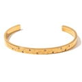 Gold-plated stainless steel cuff bracelet featuring celestial star and moon embossed motifs - Geometric Style 3 Gold