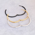 Detail view of large stainless steel hoop earrings in black, gold, and silver finishes - Smooth Round 2.0*30 / Steel