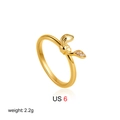 Detail of 18K gold bow ring size US 6 weighing 2.2g with sparkling zircon stones - US 6 / Bow Knot Zirconia Style