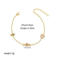 Detail view of 18K gold chain with colorful candy and shell charms showing size 27+5cm - Donut Style