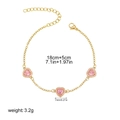 Detail of 18K gold chain bracelet with pink heart charms and size measurements - Pink Heart Rhinestone Style