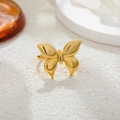 Polished 18K gold butterfly ring with 3D wings on a minimalist white textured base - Gold Plain Bow Style