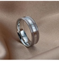 Macro shot of stainless steel wide ring featuring engraved THE CHANGE text on silk - Gray Enamel Silver