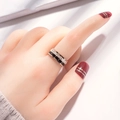 Rose gold spinning ring with Roman numerals and crystals on a model finger - US 6 / Rose Gold/Black