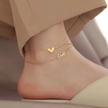 Double-layered 18K gold plated anklet featuring a heart charm and love script on a female ankle - Double Layer Heart (B10057)