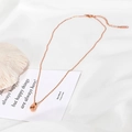 Polished rose gold teardrop necklace for women on minimalist white silk background - Rose Gold Waterdrop Necklace / Rose Gold