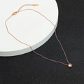 Detailed lobster clasp and adjustable chain on a rose gold single zircon necklace - Single Stone Four-Claw Necklace / Rose Gold