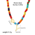 Detail of 14k gold heart and Y letter charms on a colorful rainbow beaded necklace - Style Y(T1506_25)