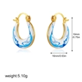 Detailed view of 18K gold U-shaped enamel earrings with blue and white ripple texture - Round Style