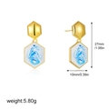 Detail view of 18K gold hexagonal earrings featuring blue and white enamel marble texture - Hexagon Style