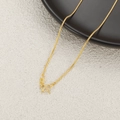 Macro shot of 24K gold plated titanium snake bone chain with a secure M-clasp closure - Snake Bone Necklace / Gold