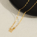 Close-up of a 24K gold plated titanium leaf-shaped chain with a classic M-clasp closure - Lips Chain Necklace / Gold