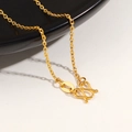 Macro shot of 24K gold plated titanium chain featuring a polished S-hook clasp detail - Beveled Edge Chain / Gold