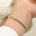 Detail of delicate sky blue braided rope bracelet with golden titanium steel beads - Gold Blue String