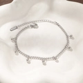 Detail of silver stainless steel chain bracelet with dangling beads and lobster clasp - Steel