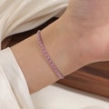 Close-up of pink woven red rope bracelet with silver titanium steel beads on wrist - Steel Color Pink String