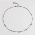 Detailed view of silver tennis necklace with evil eye charms and blue zircon stones - Necklace / Steel