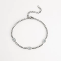 Silver evil eye bracelet with pavé-set zircons and blue gemstones on a white background - Bracelet / Steel