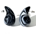 Macro detail of acrylic drop earrings featuring black and white ink marble texture - Black