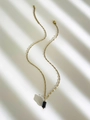 Gold stainless steel necklace featuring a minimalist black cylindrical stone pendant - Black Agate