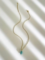 Golden stainless steel necklace featuring a cylindrical turquoise stone pendant - Blue Turquoise