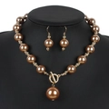 Set collana e orecchini di perle dorate con chiusura a ginocchiera in cristallo - Oro