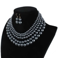 Close-up of four-layer faux pearl necklace and matching earrings on black neck bust - Five-Layer Set / Gunmetal