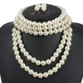 Detail of multi-layer white pearl necklace set on black bust with matching earrings - Multi-layer Beaded Jewelry Set / White