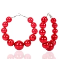 Exaggerated large hoop earrings featuring vibrant red faux pearls and silver metal hooks - Red
