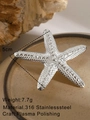 Polished silver stainless steel starfish brooch with detailed textured scale surface - Silver Starfish