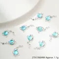 Detailansicht hellblauer Planeten-Anhänger für DIY-Schmuck Größe 27x13x6mm - Planet Anhänger (G194)