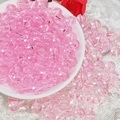 Detail of 8mm translucent pink round glass beads in a white bowl for DIY jewelry making - 8mm / Pink