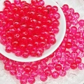 Detail of 8mm translucent pink glass beads with center holes for DIY jewelry making - Crimson
