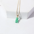 Charming gold thin chain necklace featuring a glossy translucent green bear pendant - Green