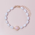 Baroque pearl bracelet with pink clover pendant and gold metal accents for women - Pink