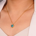 Vintage heart necklace with blue zircon pendant and golden chain on model neck - Blue (Heart 2214)