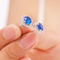 Exquisite silver stud earrings with oval blue zircon and halo of small white diamonds - Royal Blue Zirconia Stud Earrings (A1233)