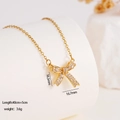 Elegant gold bow pendant necklace with sparkling cubic zirconia on white display - Bowknot (1665)