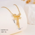Elegant gold bow necklace with sparkling cubic zirconia pendant on a thin link chain - Bowknot (1668)