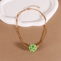 Minimalist woven gold necklace featuring a vibrant light green bead cluster pendant - Green