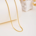Polished gold beaded necklace with spherical metallic beads on a white curved display - Round Bead Chain Only (Without Pendant)