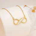 Gold infinity pendant necklace featuring sparkling zircon stones on a thin cable chain - Gold Bow Infinity White Zirconia Style (2551)