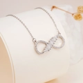 Silver infinity pendant necklace with clear cubic zirconia in a variant style - Silver Bow Infinity White Zirconia Style (2552)