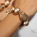 Exaggerated golden chunky bracelet featuring a mix of pebble-shaped and textured beads - Gold Thick Chain Irregular Bead Bracelet (NK27210)