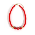 Vintage kersthalsketting met rode kralen, sneeuwvlokmotief en goudkleurige details - Rood