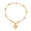 Elegant beaded bracelet featuring ivory pearls, matte gold beads and a heart pendant - Gold