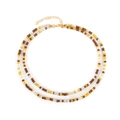 Dubbellaagse kralenketting met bruine en amberkleurige glaskralen en gouden sluiting - koffiekleur